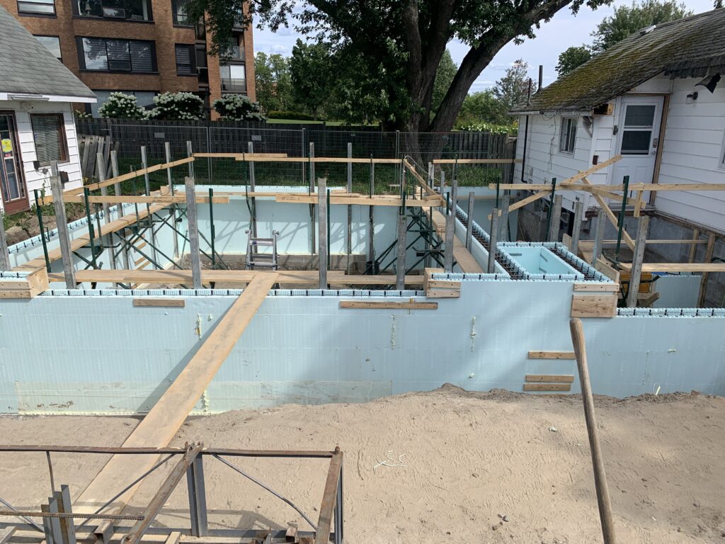 Robitaille Contracting crew installing an ICF (Insulated Concrete Form) foundation on a residential construction site
