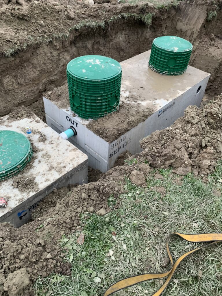 Licensed Robitaille Contracting team installing a septic system at a residential property in Trout Creek, Astorville, or North Bay