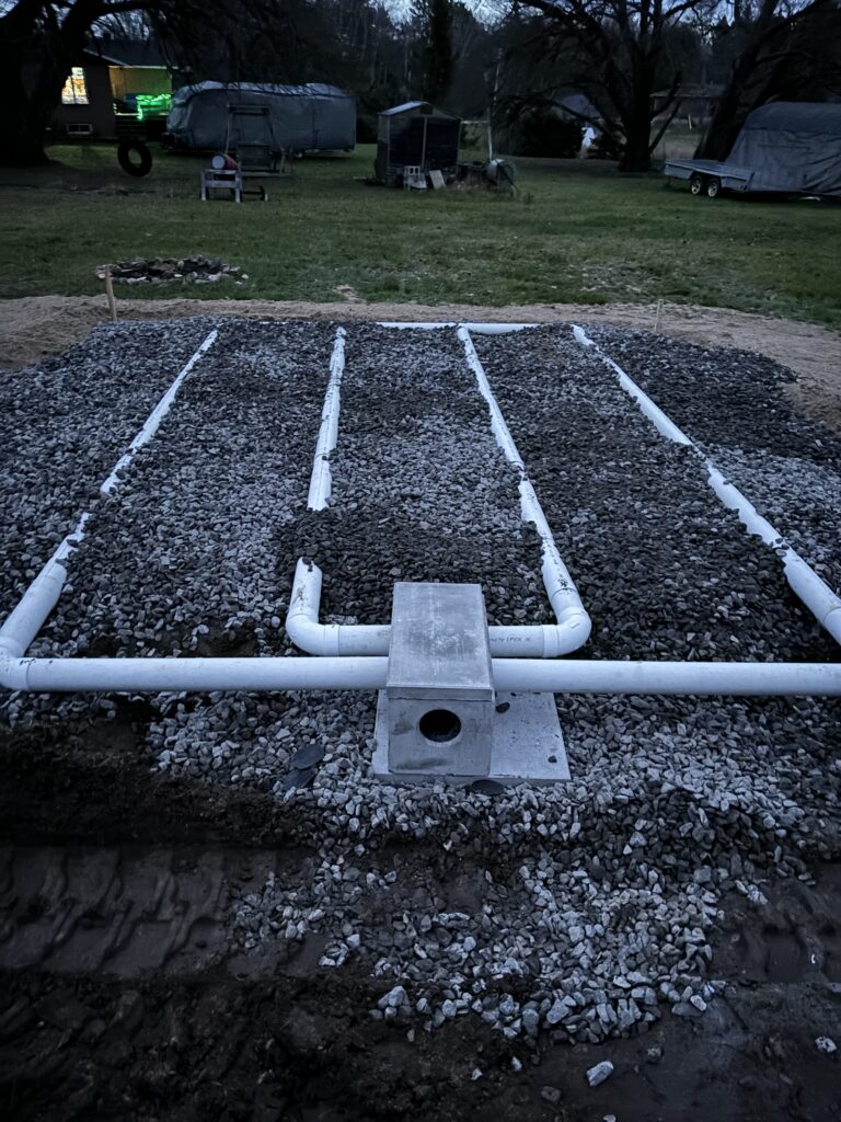 Robitaille Contracting technician reviewing septic regulations with a property owner in Restoule, Ontario