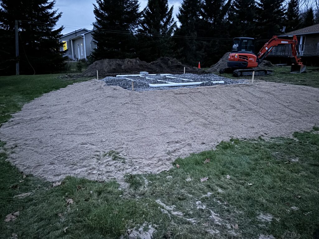 Robitaille Contracting crew installing a septic system with precision excavation in Bonfield, Ontario