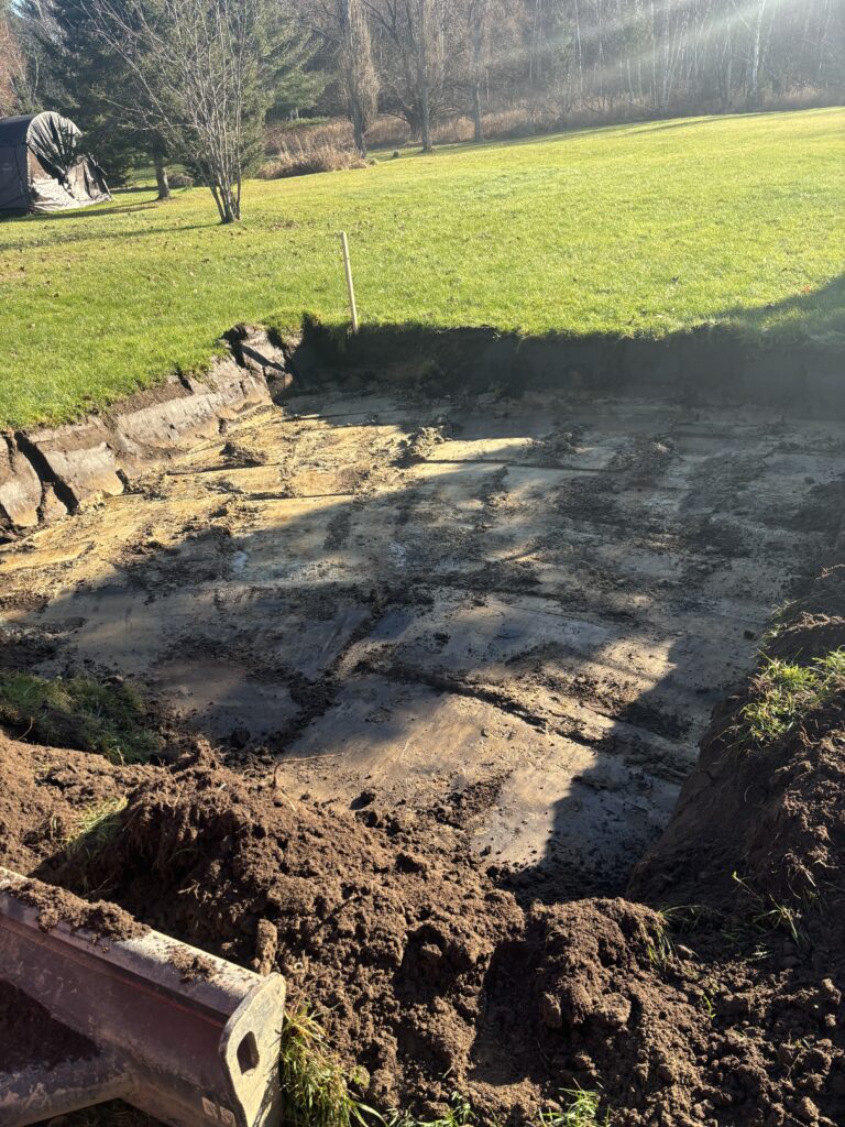 Robitaille Contracting technician performing preventative septic maintenance at a home in Corbeil, Ontario