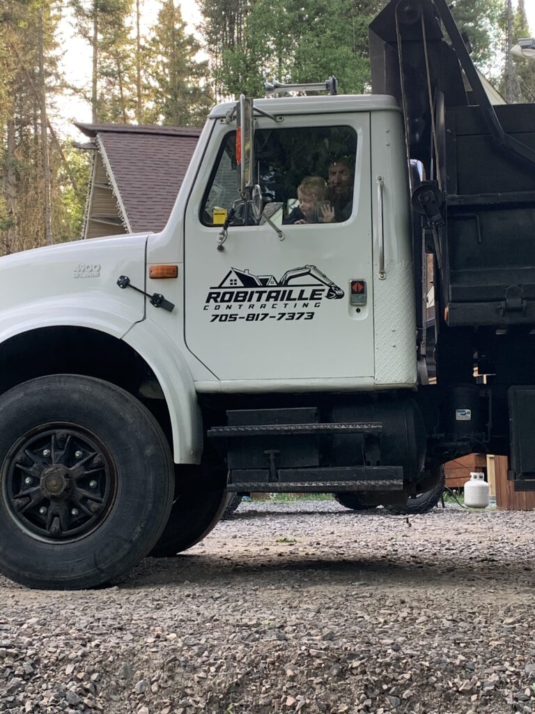 Robitaille Contracting crew providing trusted septic services at a residential property in Corbeil, Ontario